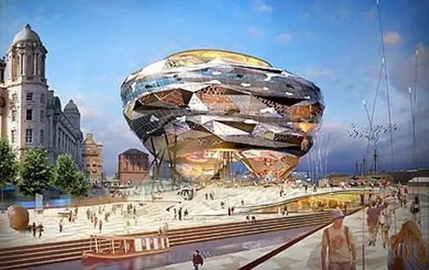 People walking near a futuristic, metallic building with a reflective surface, located on a city waterfront with historic buildings and a cloudy sky.