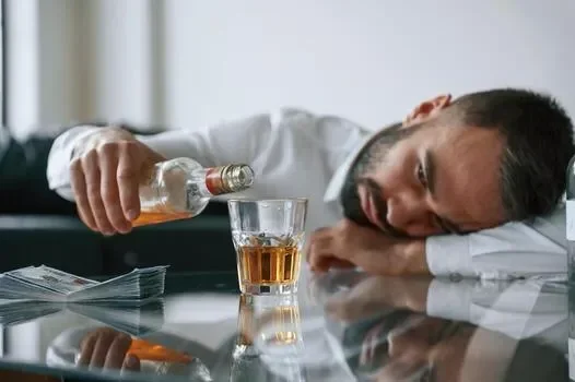 conception-of-addiction-upset-young-man-drinker-alcoholic-is-indoors-photo.webp