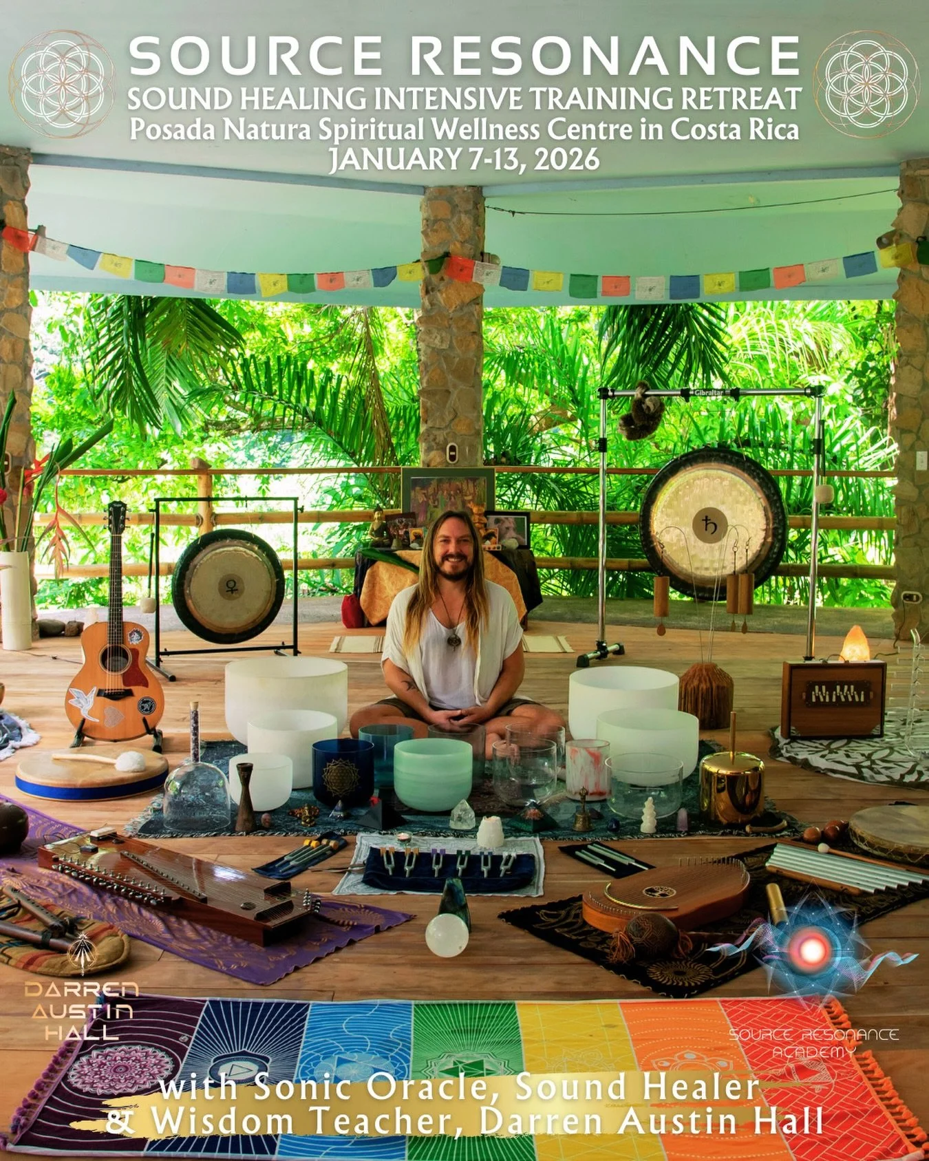 A man with long hair and a beard sitting cross-legged in front of a variety of singing bowls, crystal imagery, and musical instruments in a lush, green, outdoor setting with stone pillars. There are gongs, a guitar, and various spiritual artifacts. A