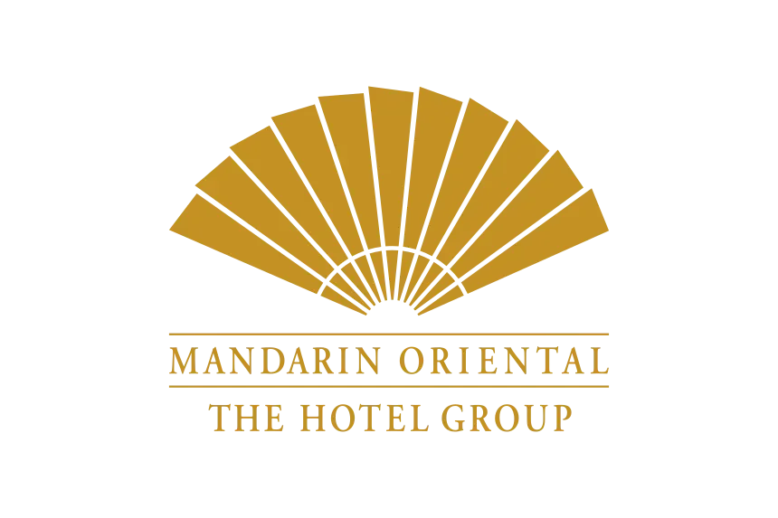 Logo for Mandarin Oriental, The Hotel Group, featuring a stylized gold fan above the text.