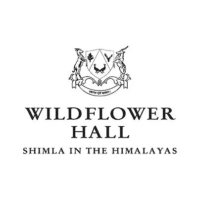 Logo for Wildflower Hall, Shimla in the Himalayas featuring a crest with animals and trees.
