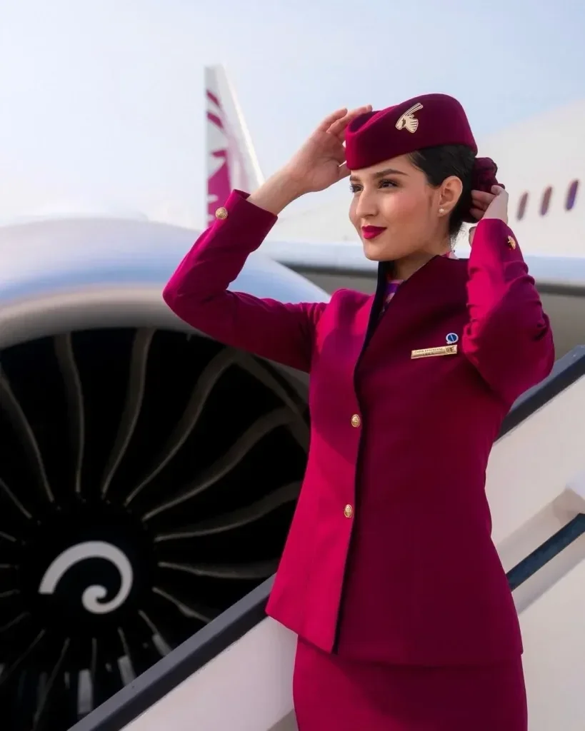 Qatar Airways website homepage showing an airplane flying above clouds and promotional text about saving on flights to the United Kingdom, Italy, France, and more.