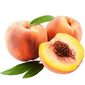 Two peaches, one whole and one sliced open showing the pit, with green leaves.