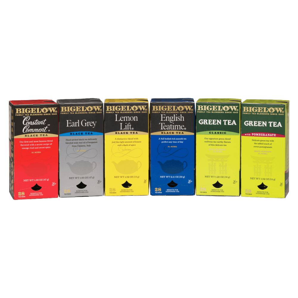 Six boxes of Bigelow Tea arranged in a row, featuring different flavors including Constant Comment Black Tea, Earl Grey Black Tea, Lemon Lift Black Tea, English Teatime Black Tea, Green Tea Classic, and Green Tea with Pomegranate.