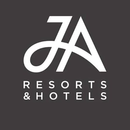 Logo for JA Resorts & Hotels on a dark background