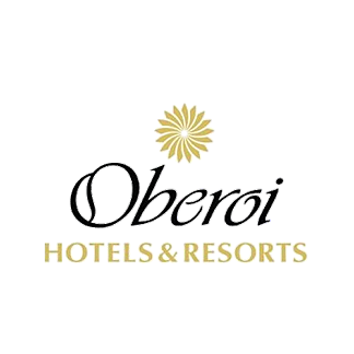 Oberoi Hotels & Resorts logo with a floral emblem above the text.