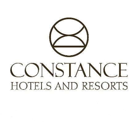 Logo for Constance Hotels and Resorts with a circular emblem above the text.