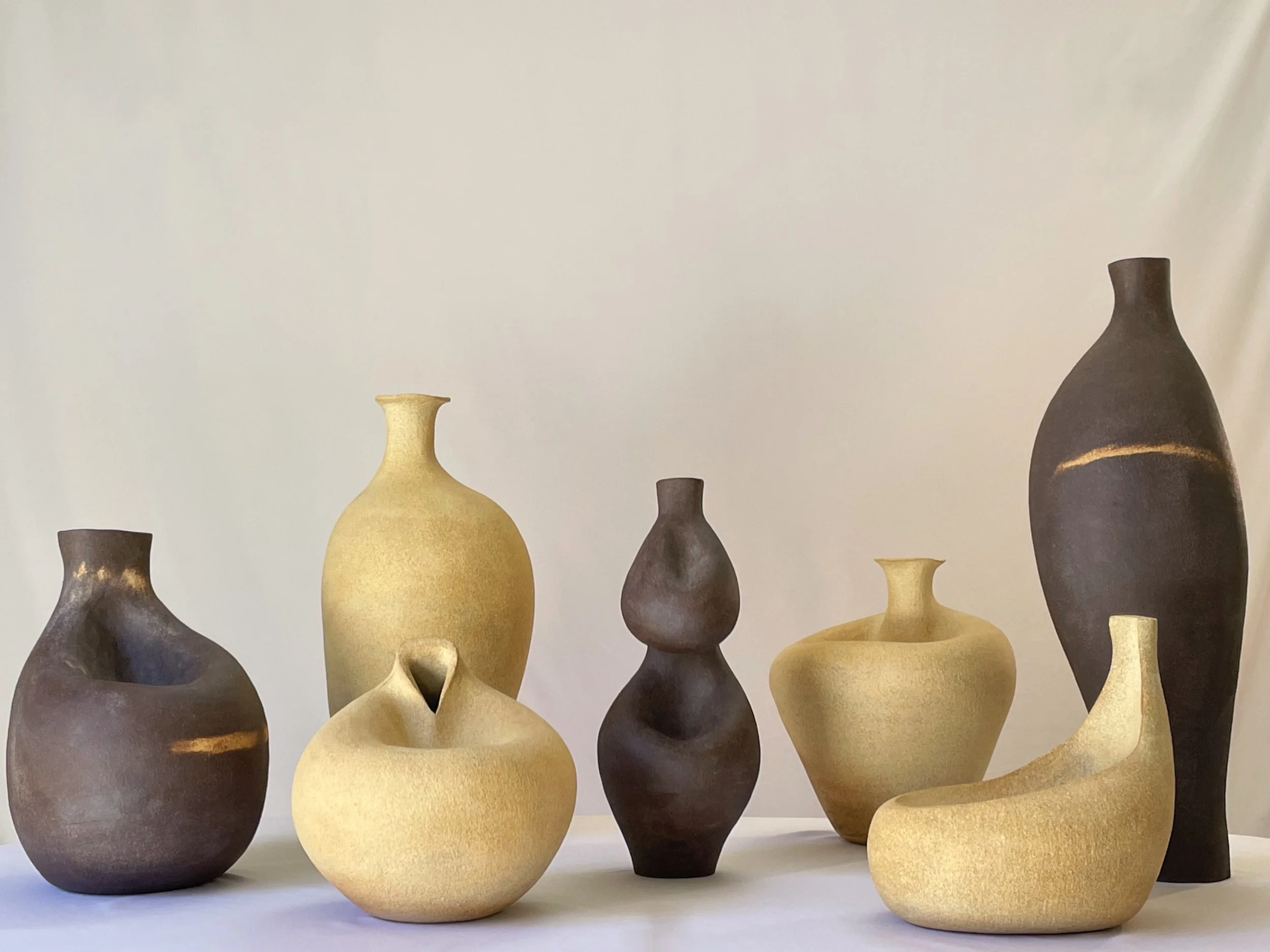 2024 - 2025 collection from made of earth ceramics, artist Cindal Ma. It's a collection of light and dark clay sculpture pieces.