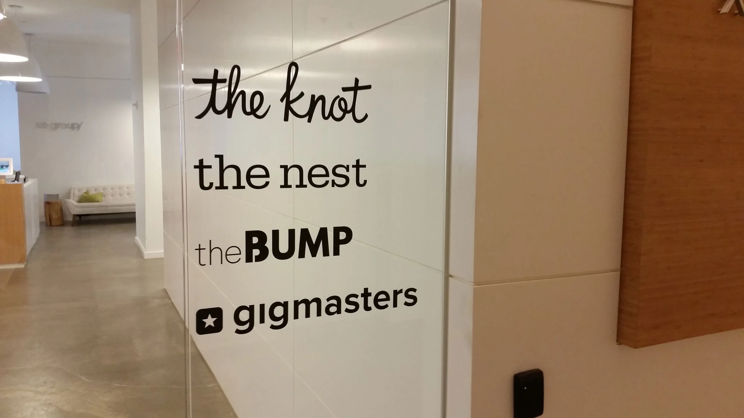 custom die-cut adhesive black vinyl lettering decal applied to office glass door inside lobby way in Manhattan NY.