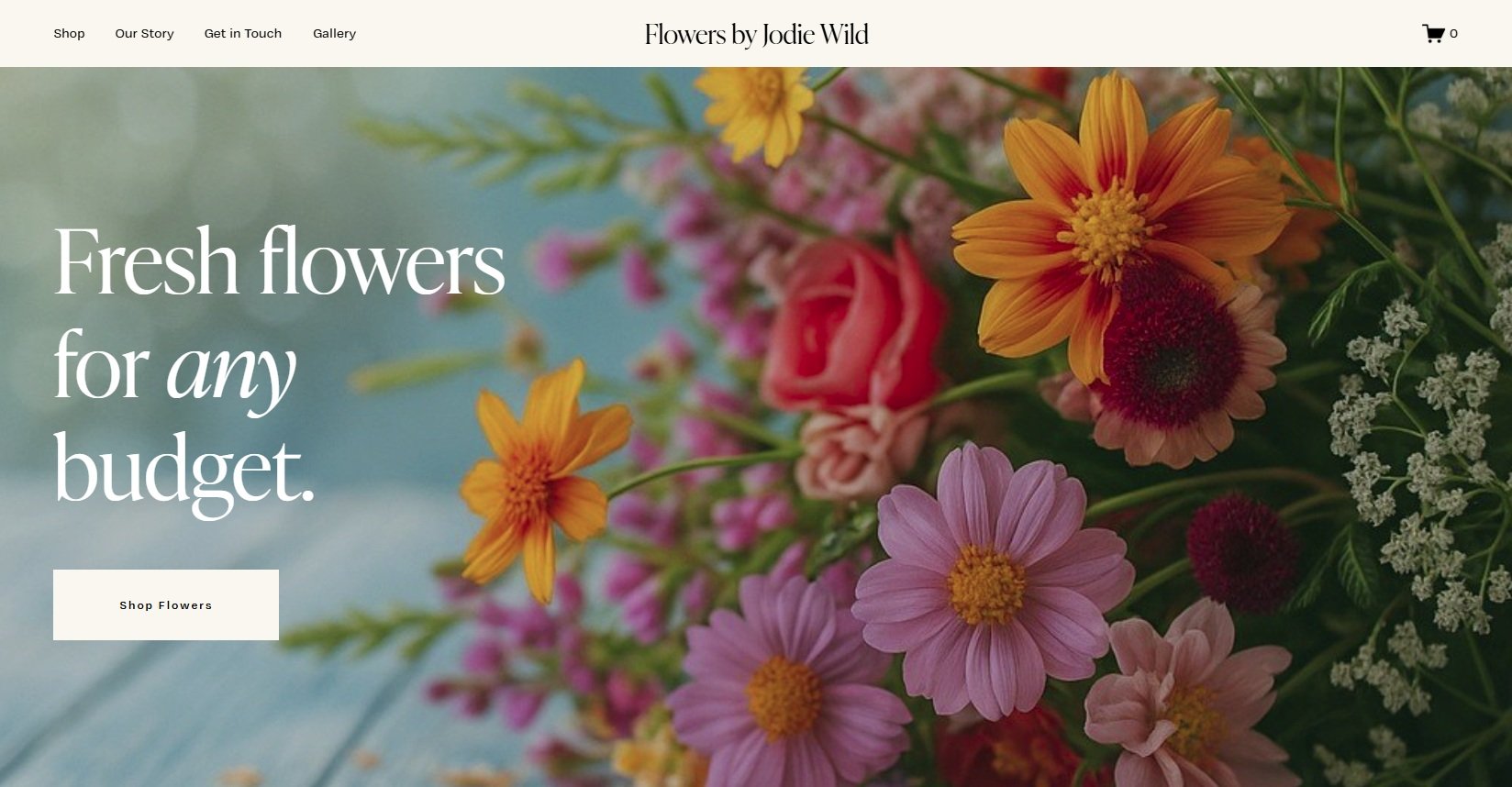 Colorful bouquet of assorted fresh flowers including pink, orange, yellow, and purple blooms.
