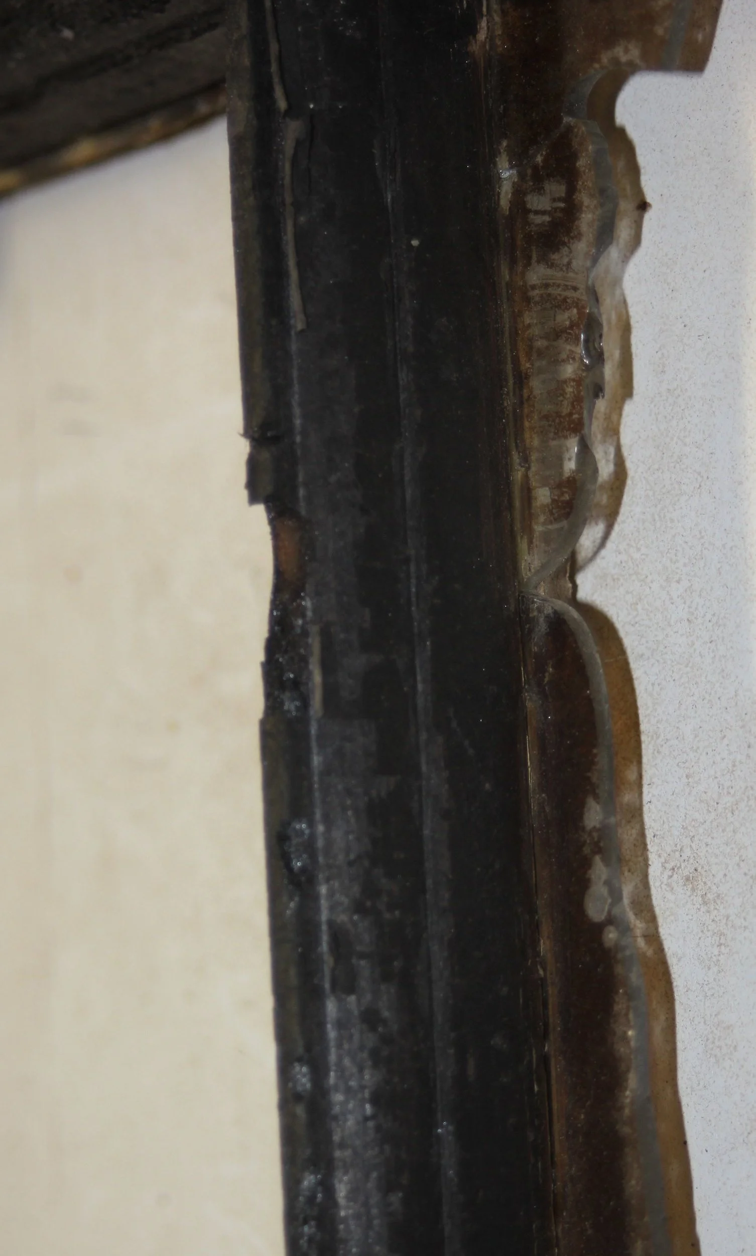 Extreme closeup of badly burned window from Yorktown Heights Railroad Station, shows intense damages before restoration process.