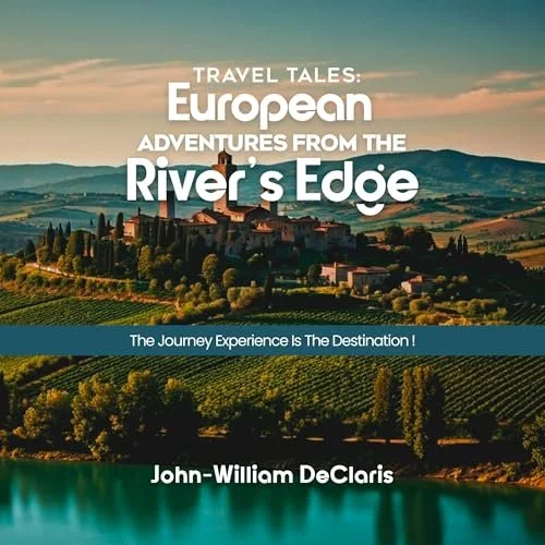 A scenic view of a European hillside town with a river in the foreground and rolling green vineyards in the background. The text overlay reads: 'Travel Tales: European Adventures from the River's Edge. The Journey Experience Is The Destination! John-William DeClaris.'