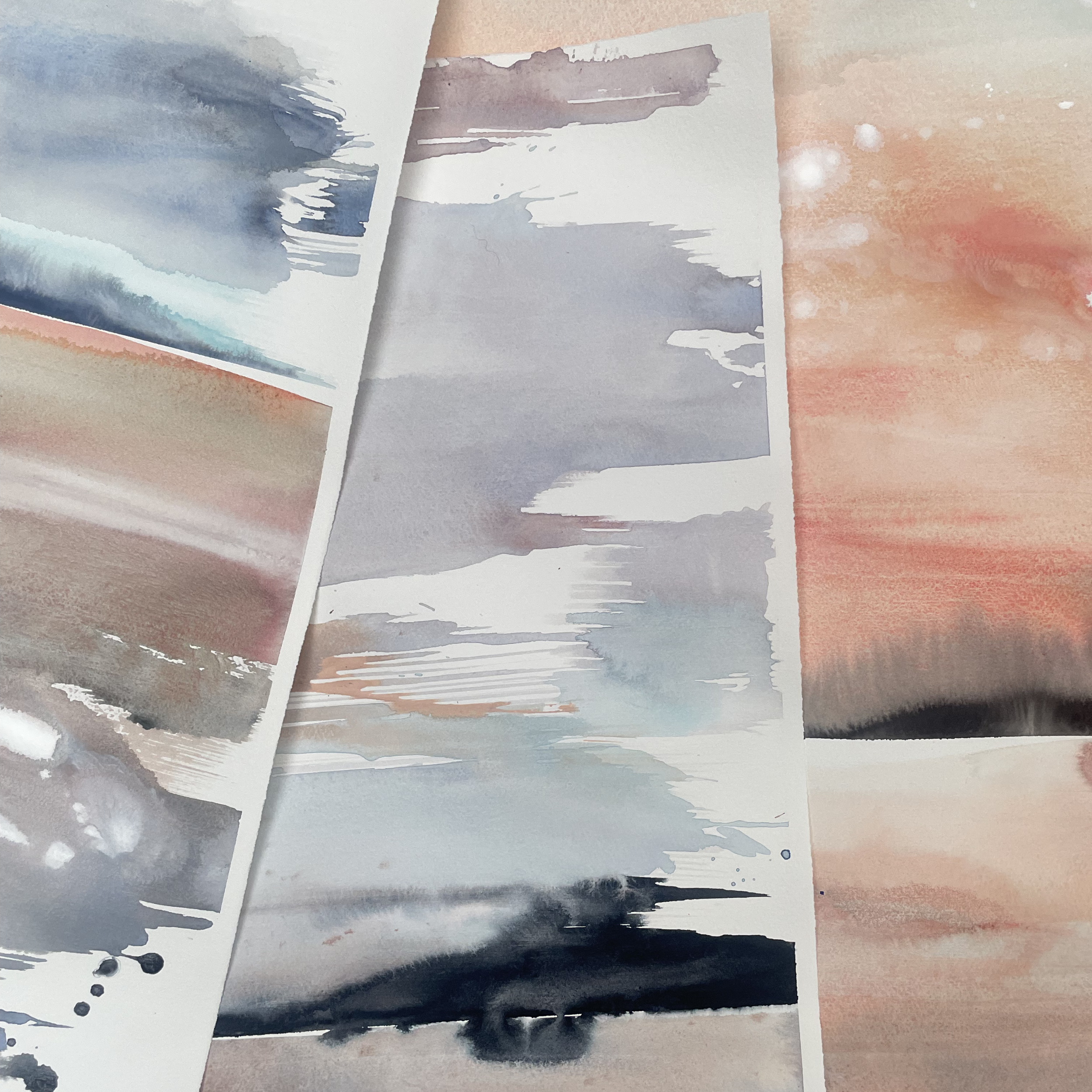 close up detail photo of watercolour landscape paintings on paper