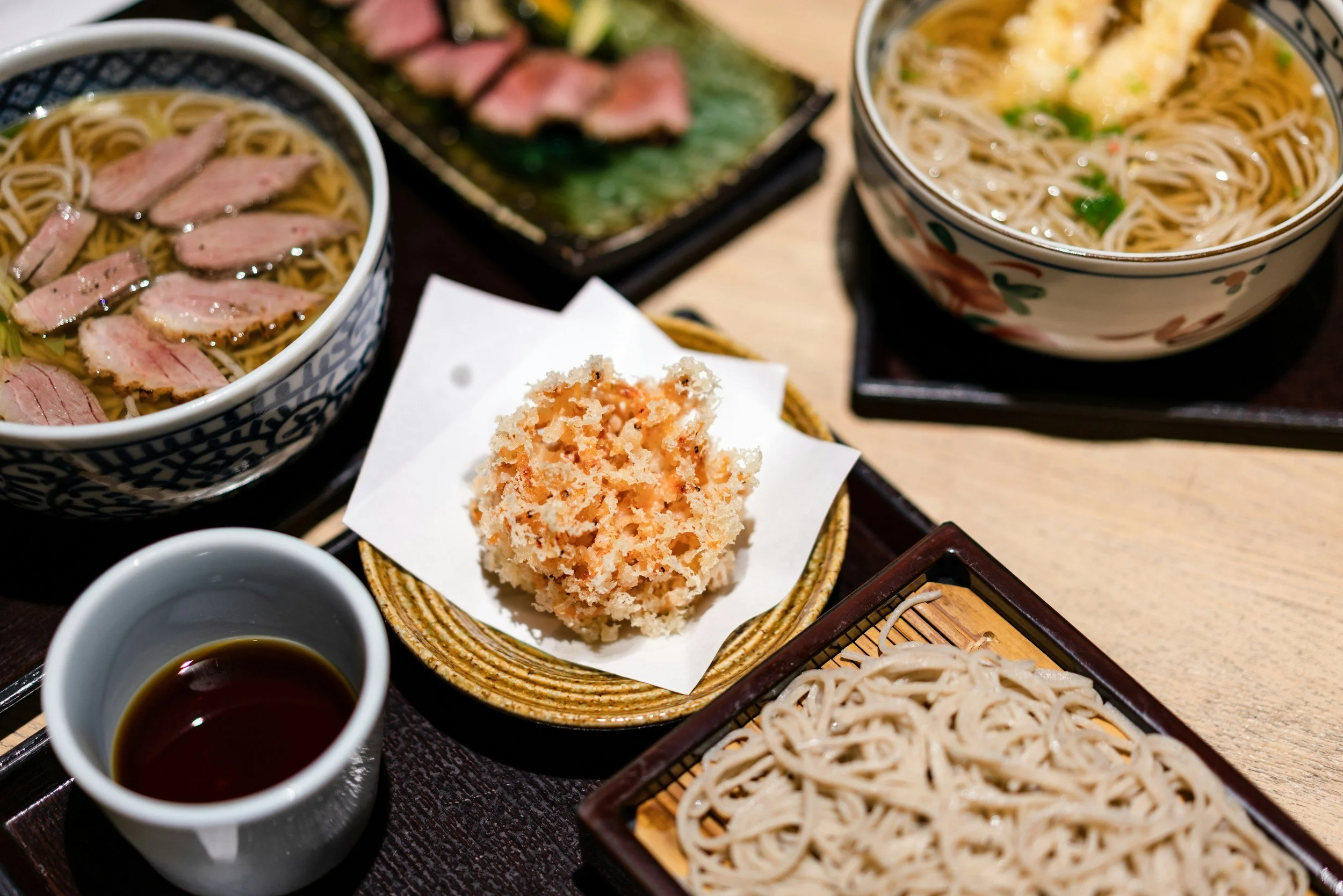 Bwol of ramen, hot tea and chopsticks