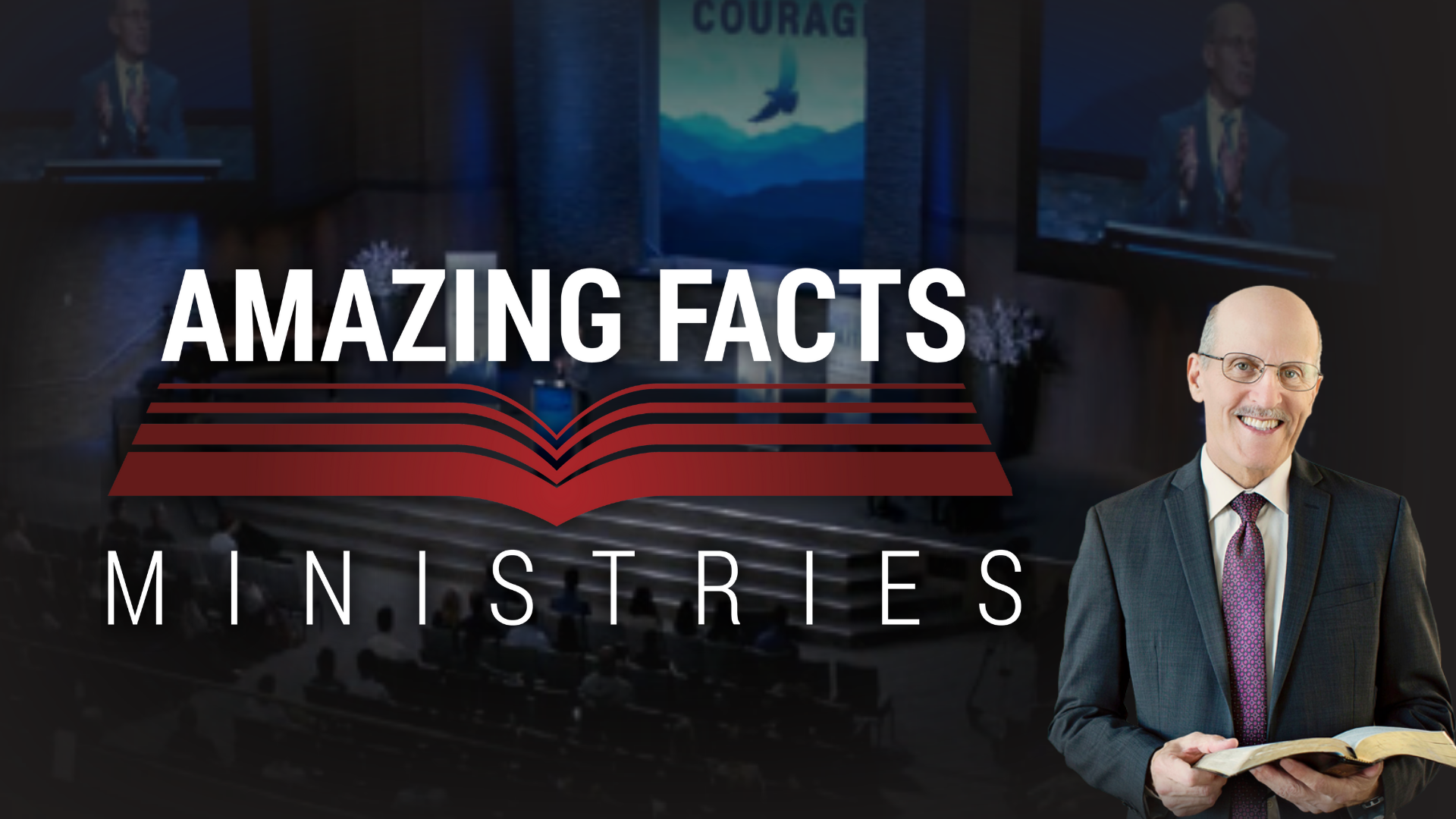 A smiling Doug Bachelor in a suit holding a Bible in a church setting with a large screen behind him displaying the words "Amazing Facts Ministries" and a mountain landscape with a flying bird.