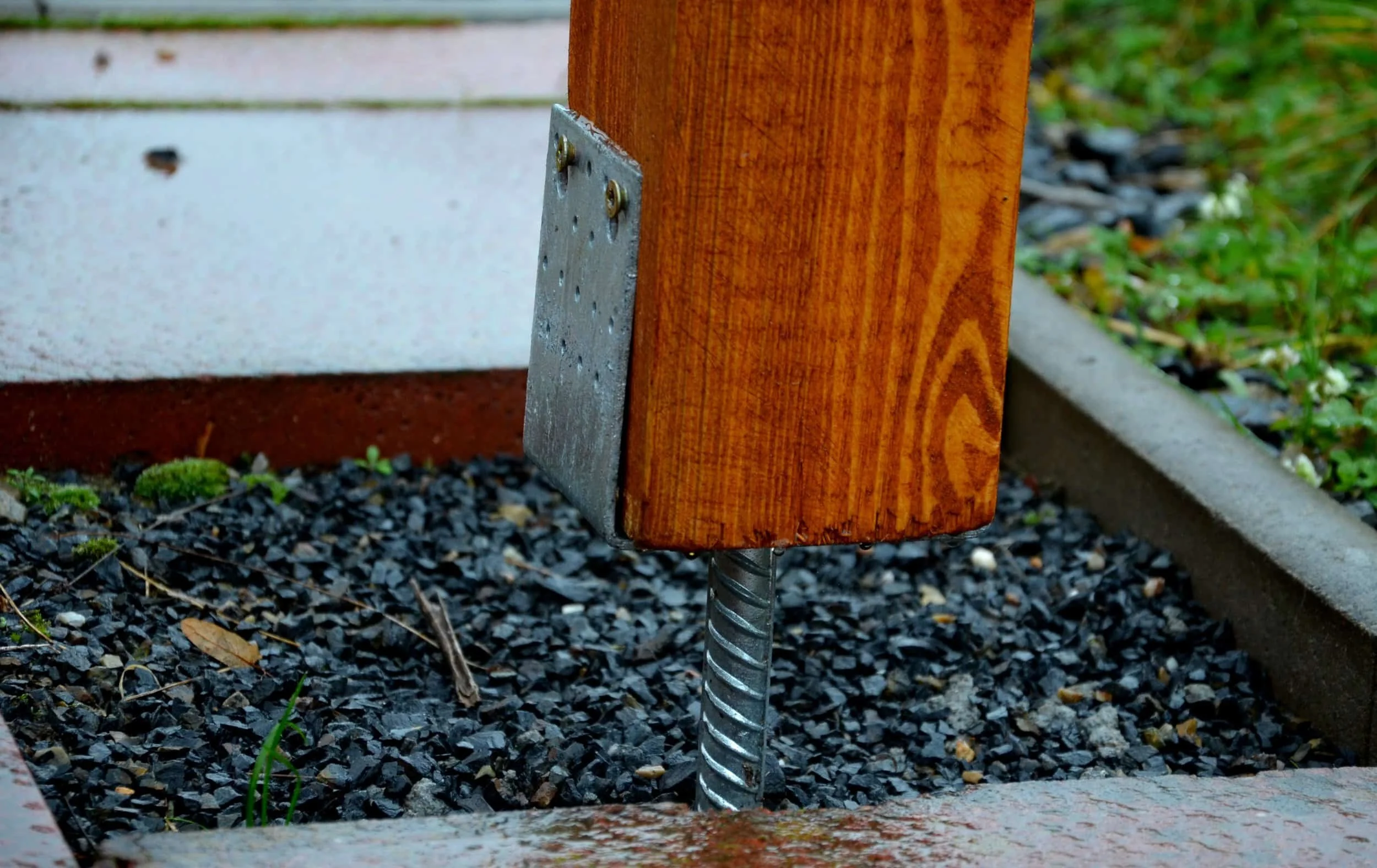 putting timber posts in steel stirrups off the ground helps prevent termite damage.