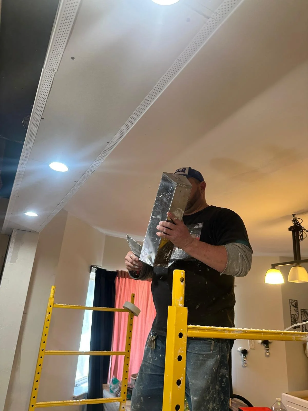 M&L Quality Construction LLC Founder working on home renovation project - cabinet installation