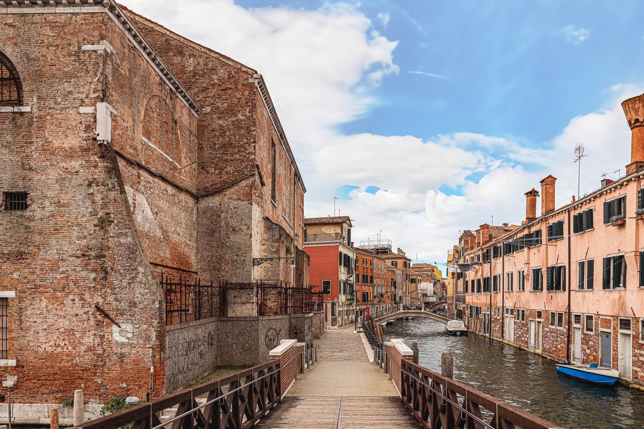 This wasn’t the Venice they show on postcards. No gondolas here — just the hush of footsteps, the scent of old brick, and the quiet defiance of a graffitied wall. I lingered here longer than I planned, watching the water mirror stories no one was tel