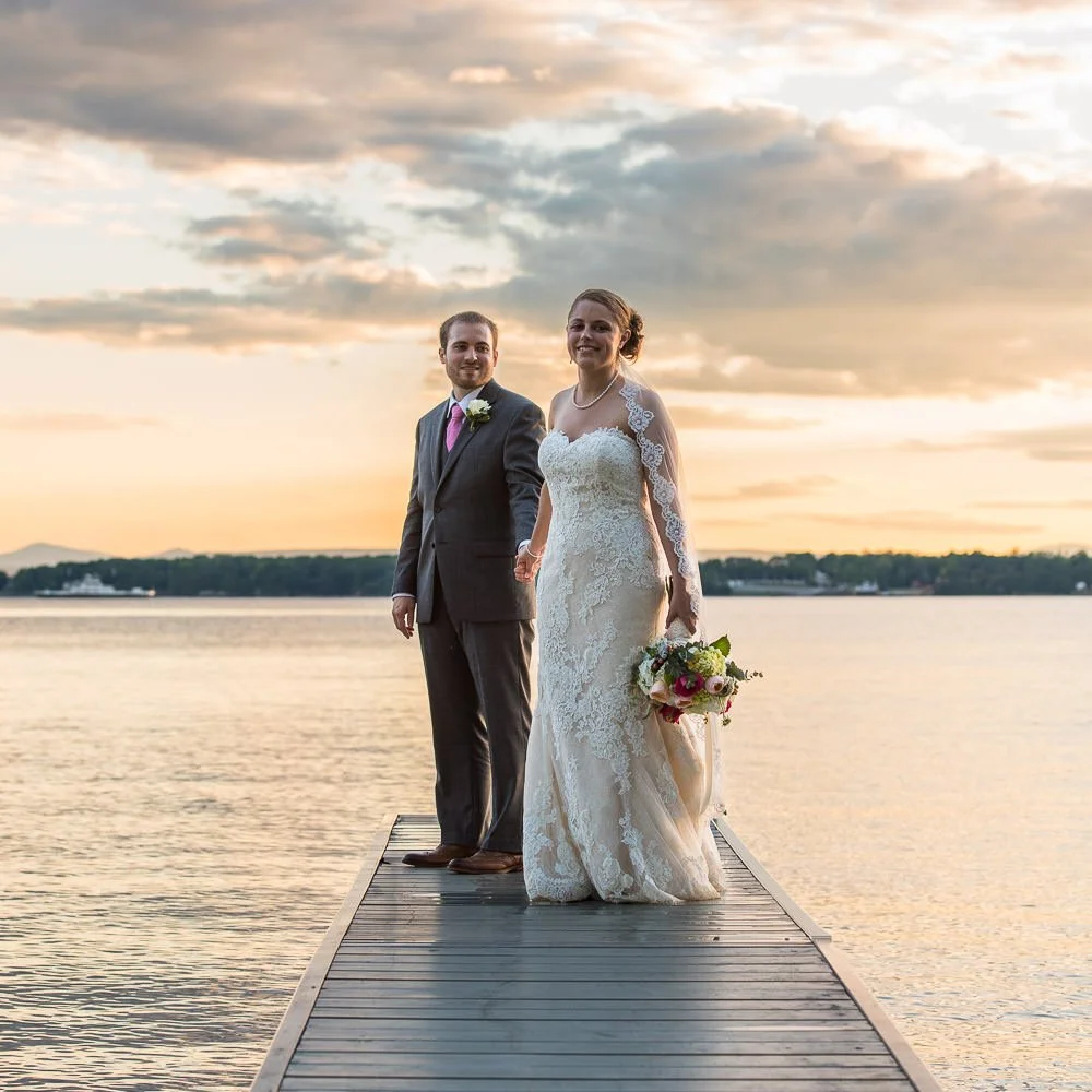 bride-and-groom-on-lakeside-dock-at-sunset.jpg