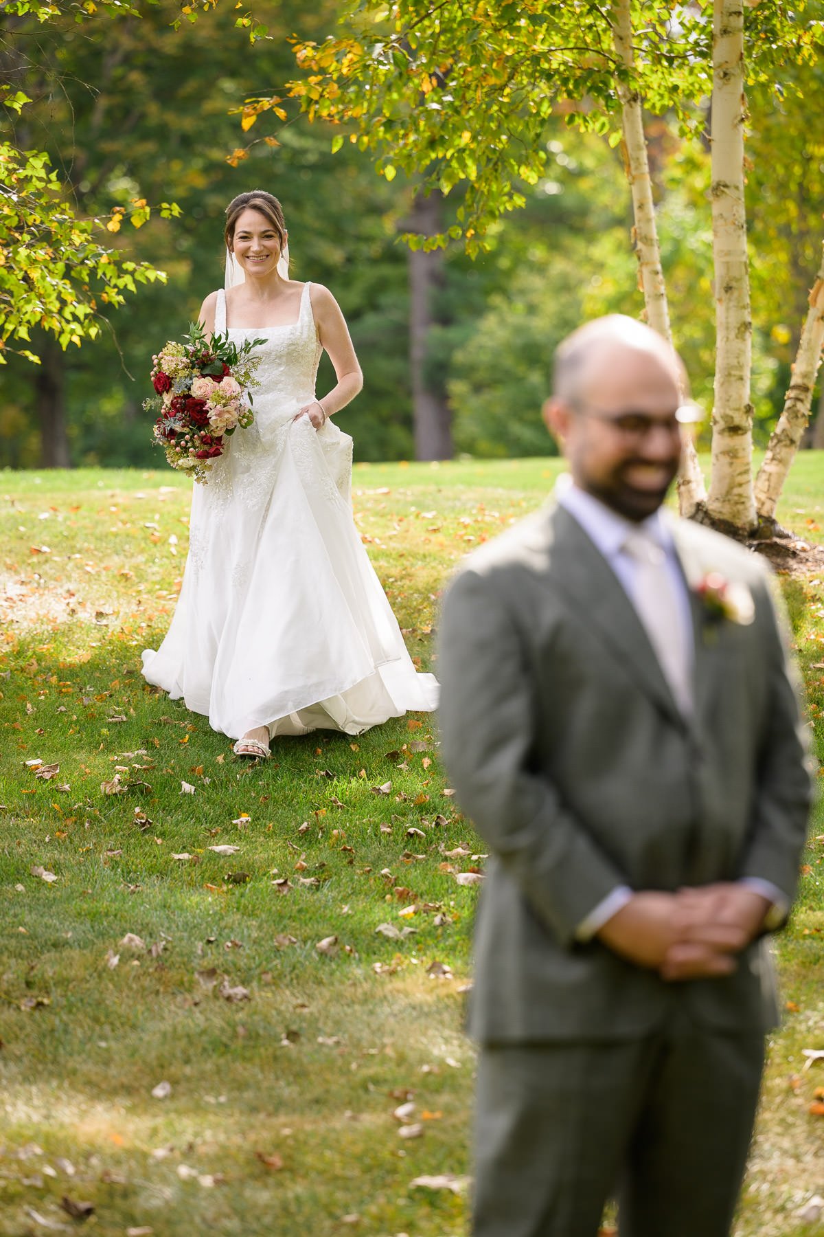 Chelsea and David share their first look on the lawn at the Inn at Manchester in Vermont, beginning with David waiting as Chelsea approaches.