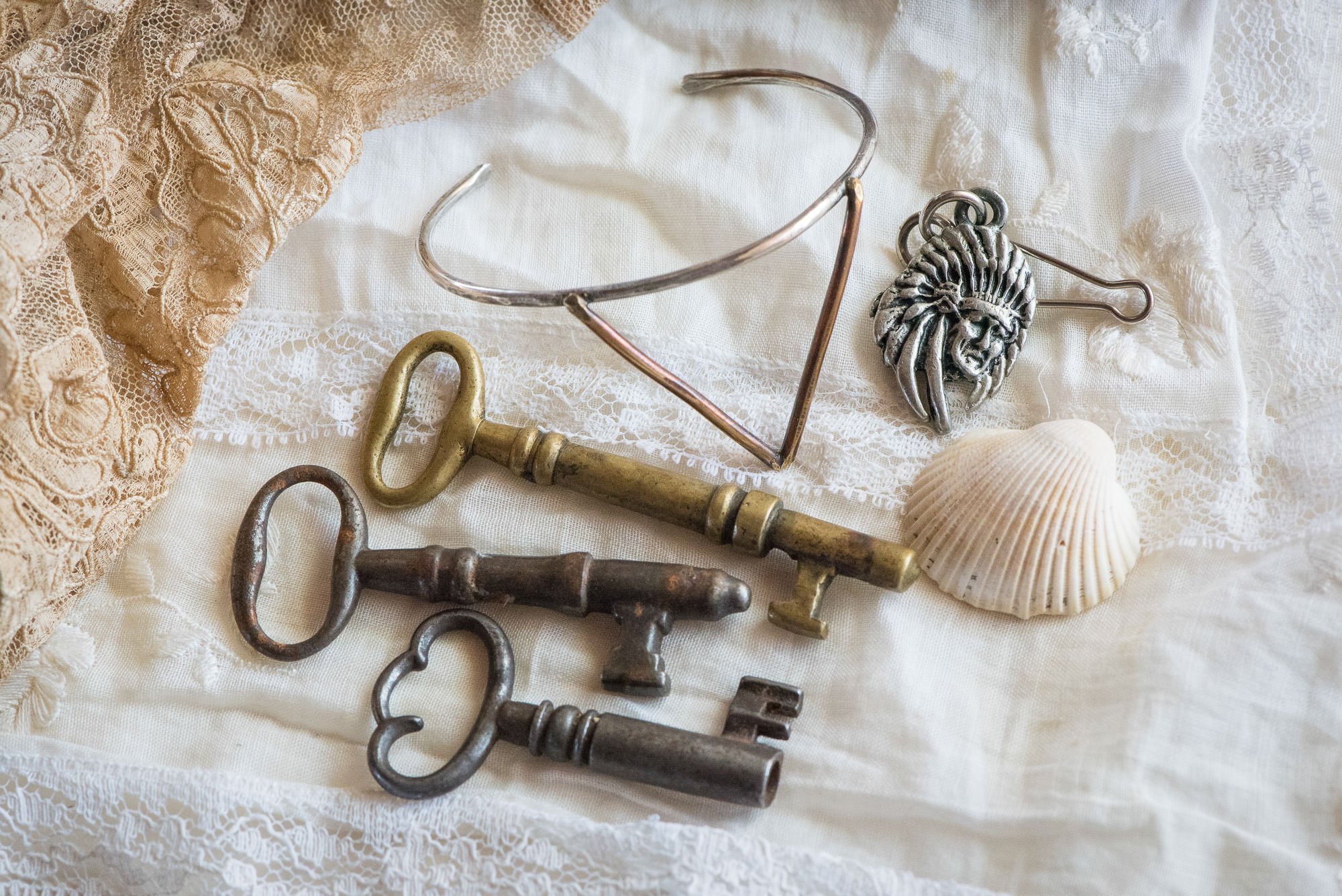 Flatlay with vintage keys and desert elements for a styled Joshua Tree elopement