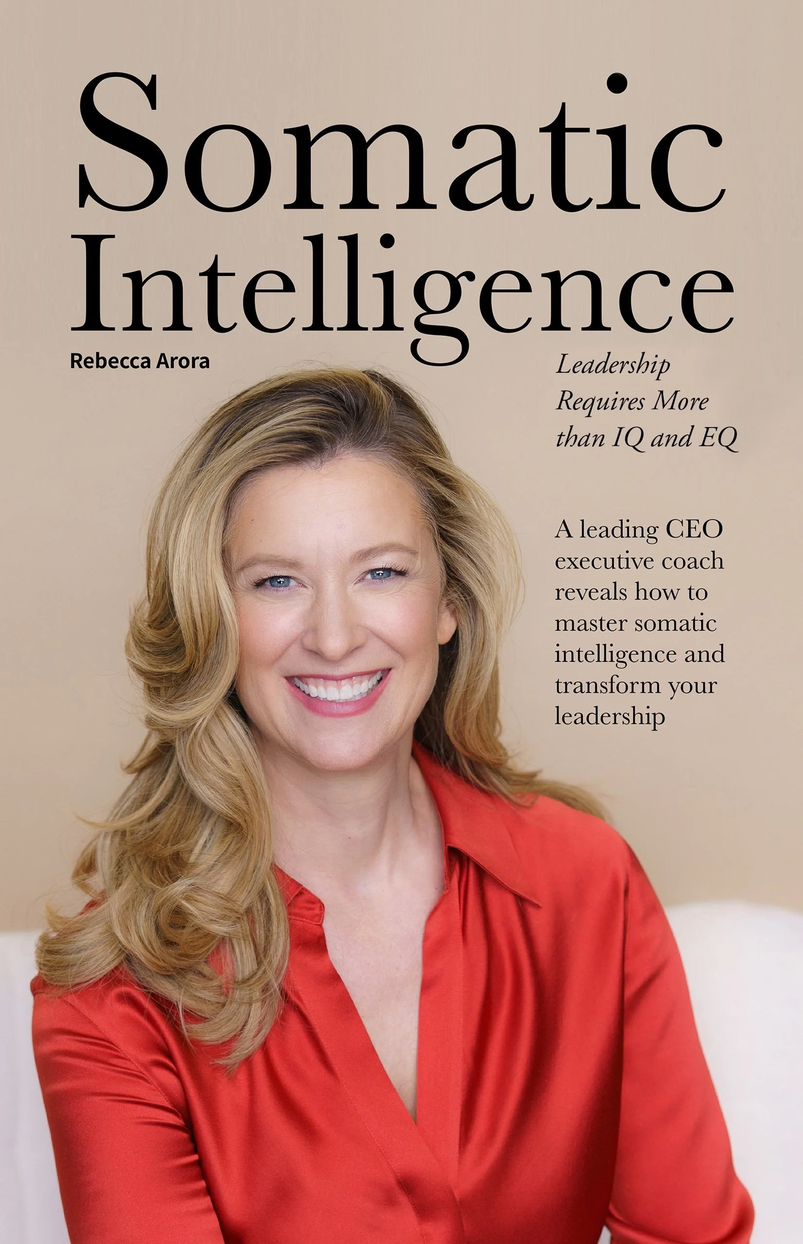 Book cover titled "Somatic Intelligence" by Rebecca Arora featuring a smiling woman with long blonde hair, wearing a red blouse, against a beige background