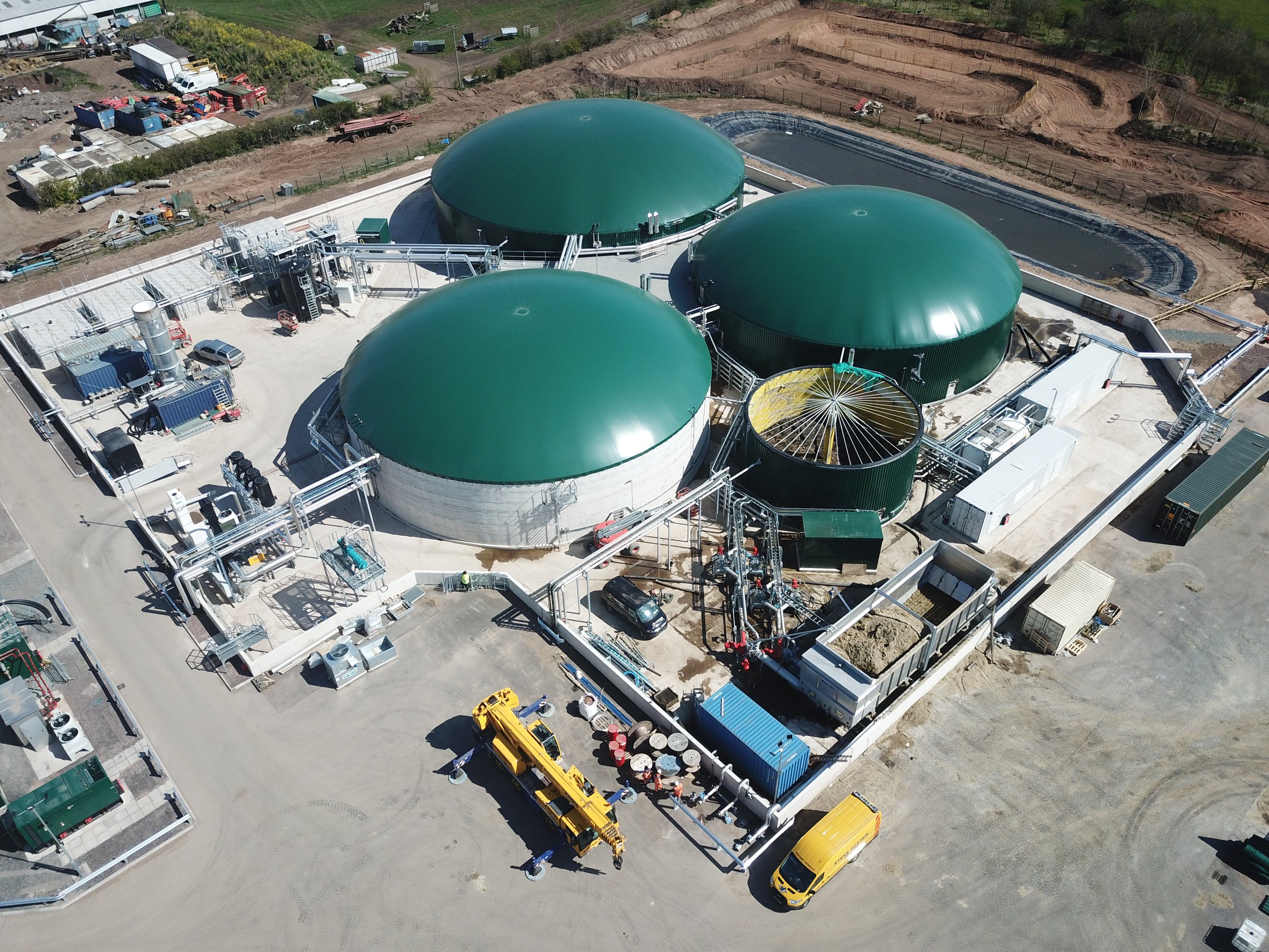Anaerobic Digestion plant on site, 3 large green containers, biogas plant