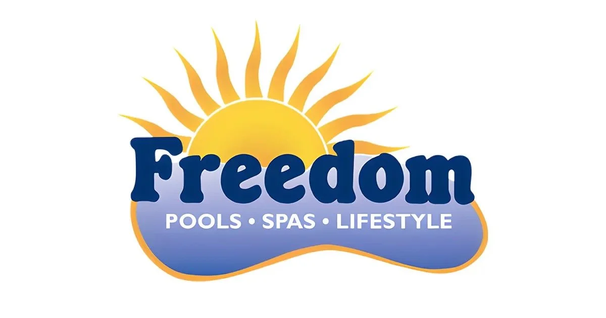 Logo for Freedom Pools, Spas, and Lifestyle featuring a yellow sun with rays, the word 'Freedom' in dark blue, and a blue banner with white text listing 'Pools,' 'Spas,' and 'Lifestyle'.