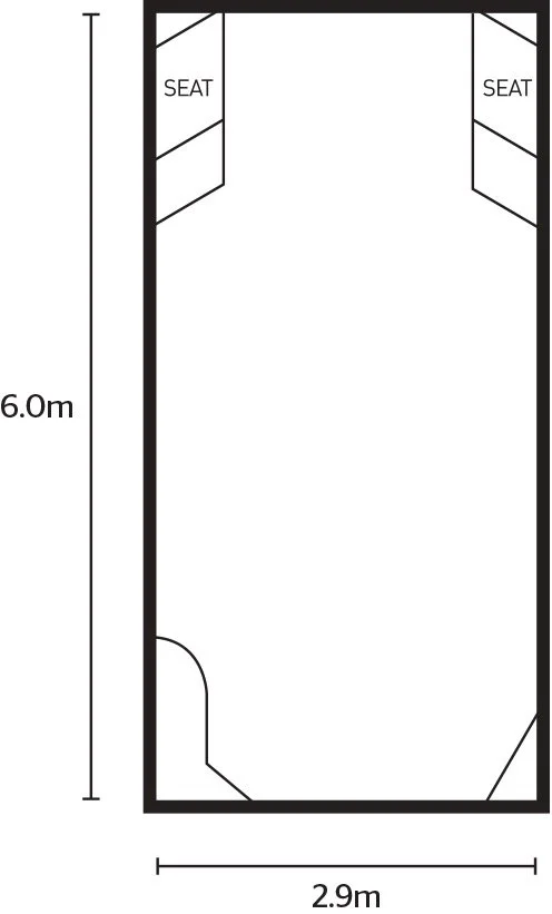 Floor plan of a 6-meter by 2.9-meter rectangular room with two corner shelves labeled 'SEAT' and a door located on the left side.