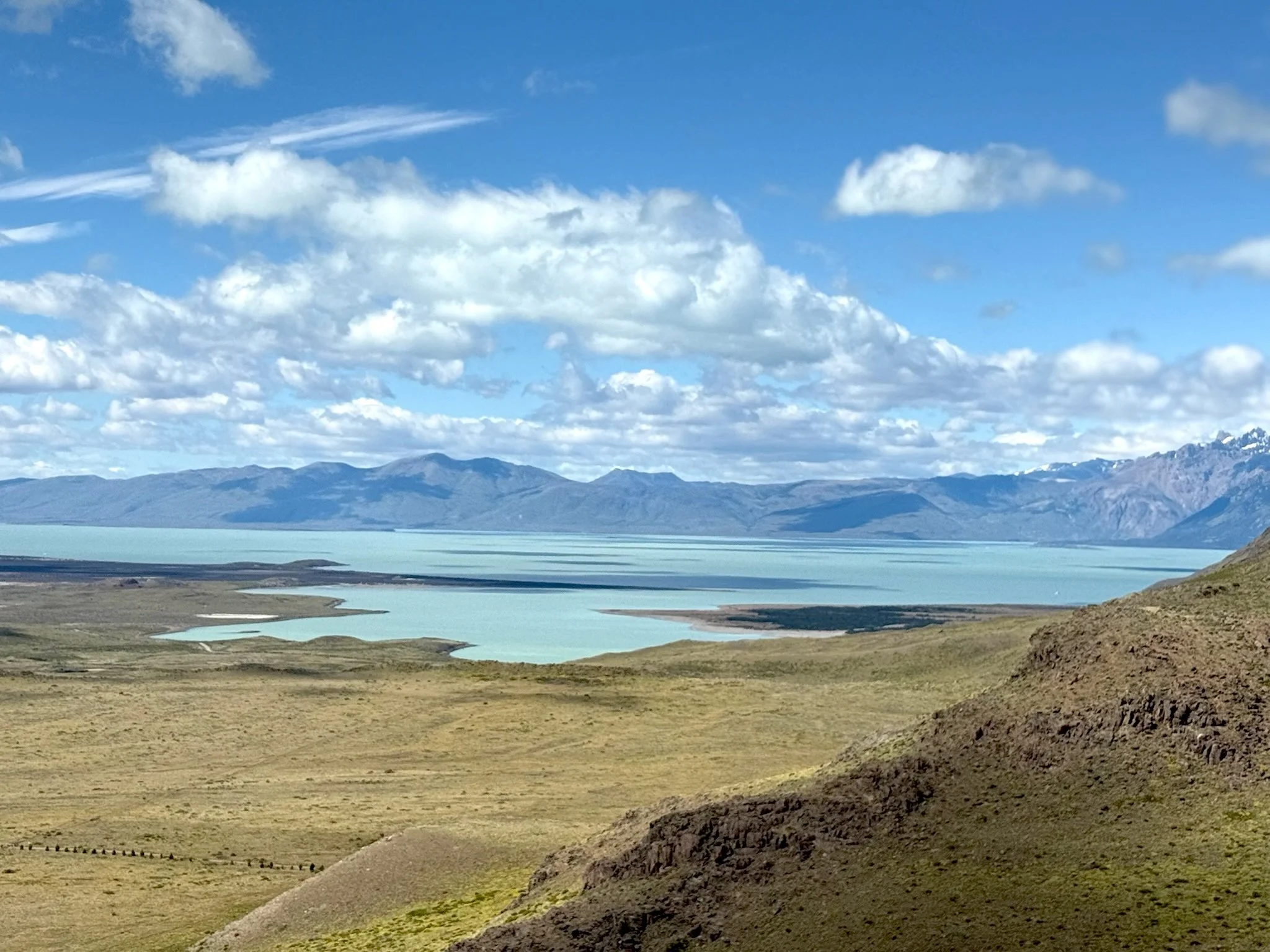 View from Mirador de las Águilas overlooking the Patagonian steppe and lakes near El Chaltén.