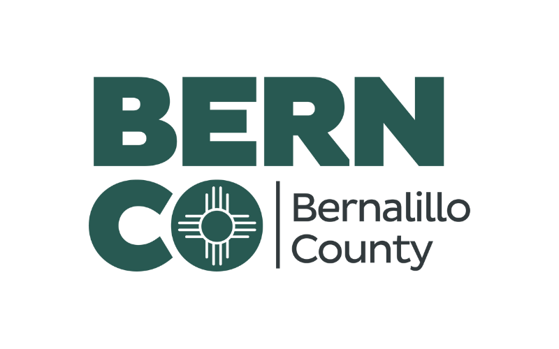 Bern County logo featuring bold text with a circular emblem in the 'C' of 'CO' and the words Bernalillo County.