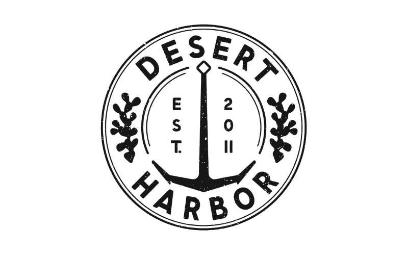 A circular logo with an anchor in the center, the words "Desert Harbor Est 2019" around the top and bottom, and decorative leaves on both sides.