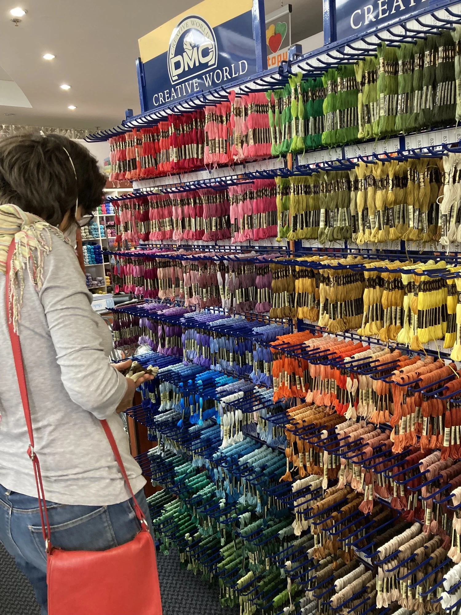 Tamar Mason selecting thread for Mochudi embroidery