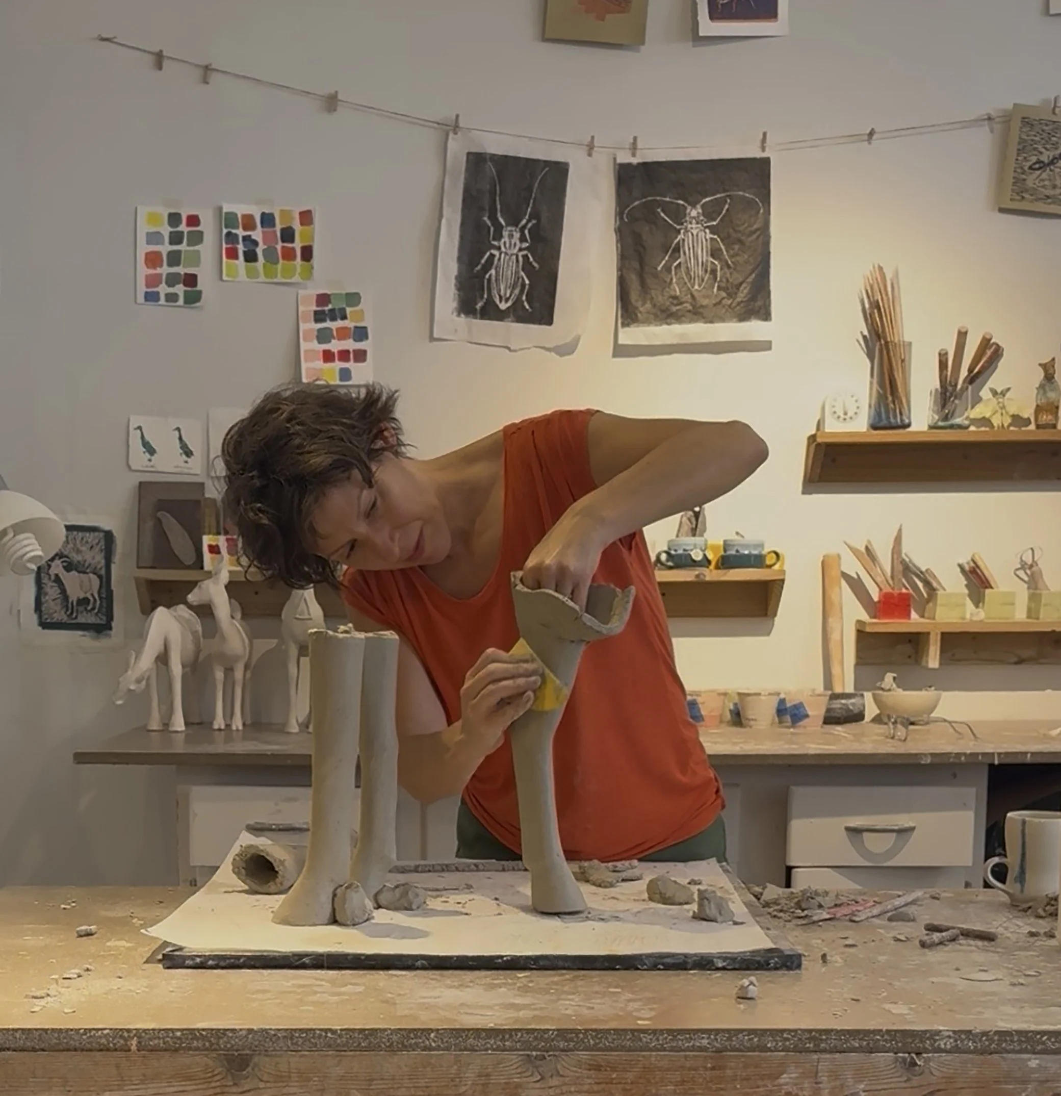 Lucie Piedra coil building a large ceramic sculpture