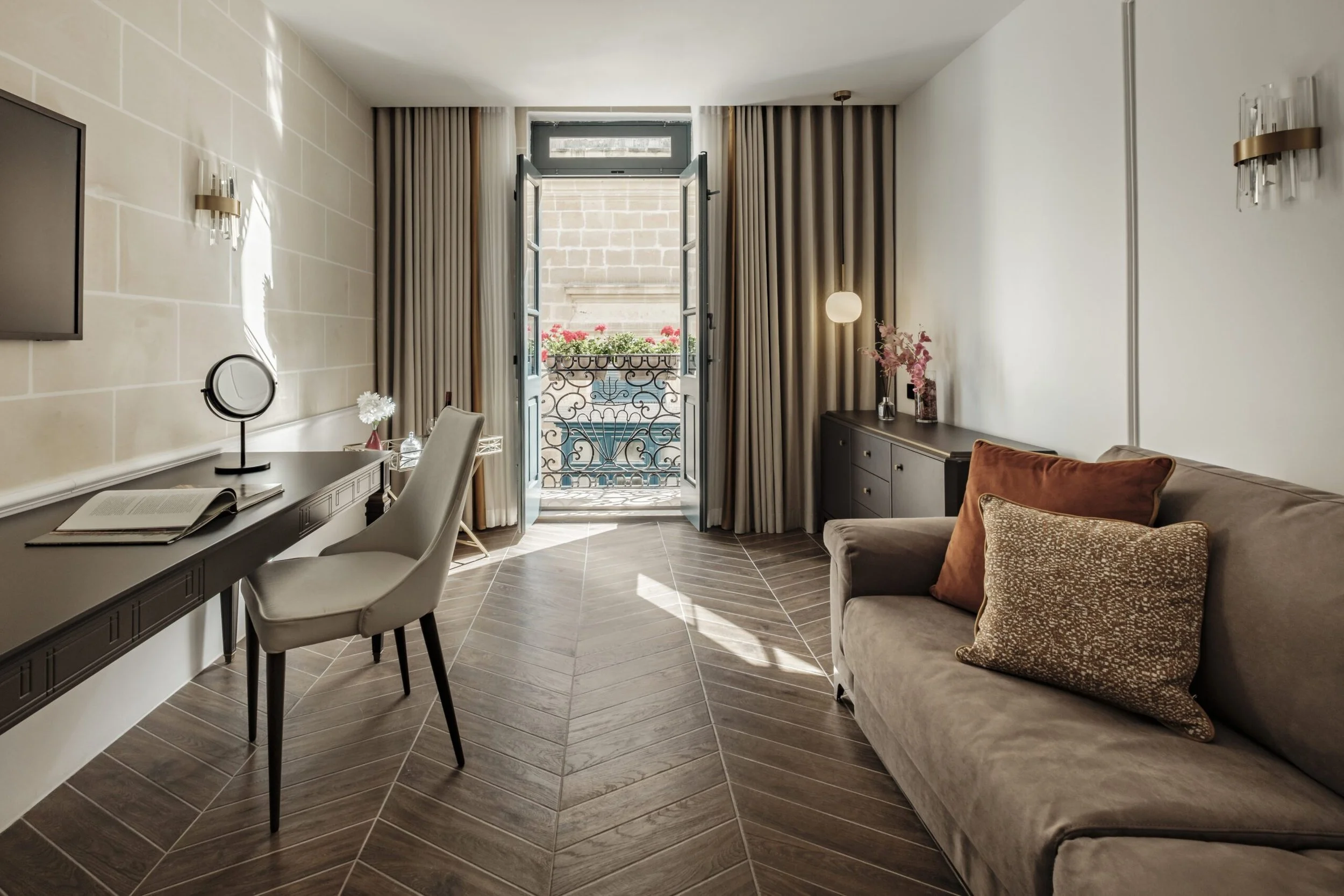PREMIUM SUITE - A spacious suite combining contemporary artistry with comfort, featuring distinct living spaces and a composed atmosphere designed for relaxed stays.
