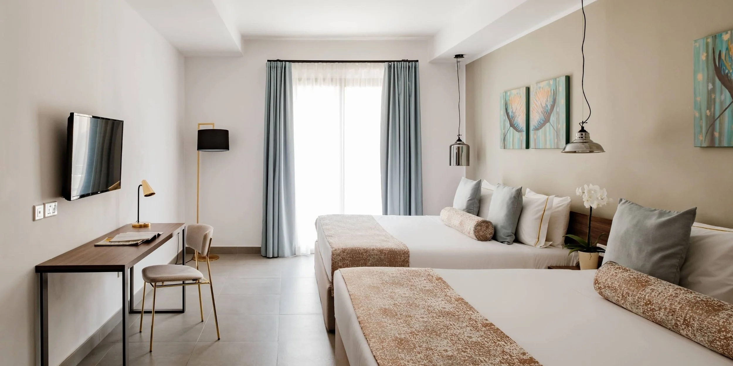 FAMILY ROOM - A thoughtfully designed room offering generous space and flexibility, ideal for families seeking comfort, privacy, and a refined setting.