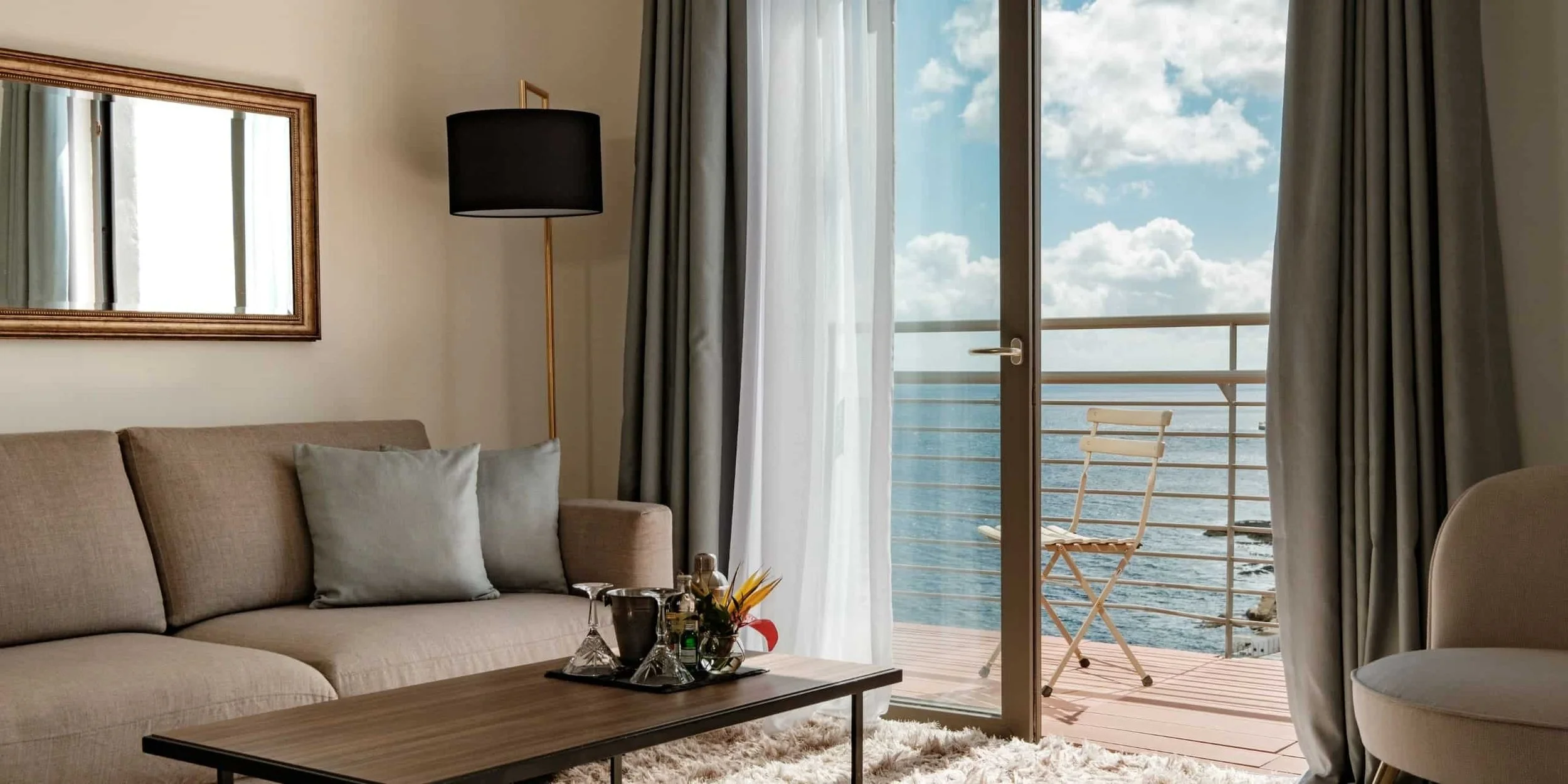 PREMIUM SUITE - An elegant suite set on the higher floors, featuring a private balcony and sweeping views across Sliema and the Mediterranean.