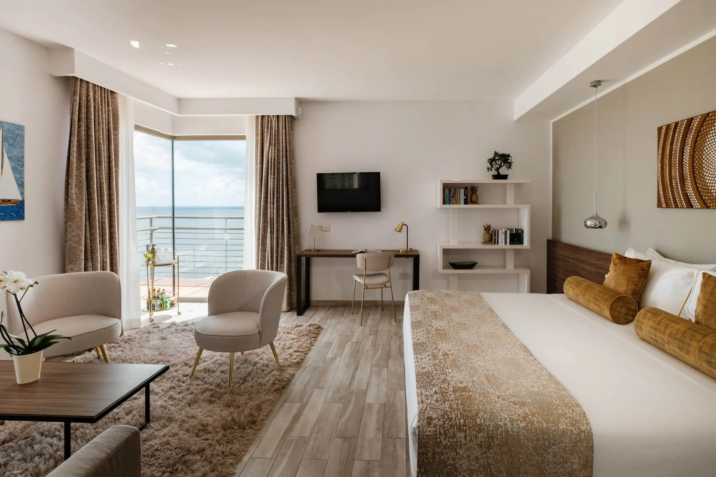 SUNNY’S SUITE - A light-filled seaview suite created in honour of the spirit behind the 1926 Collection, offering refined interiors, a private balcony, and a calm residential atmosphere defined by warmth and elegance.