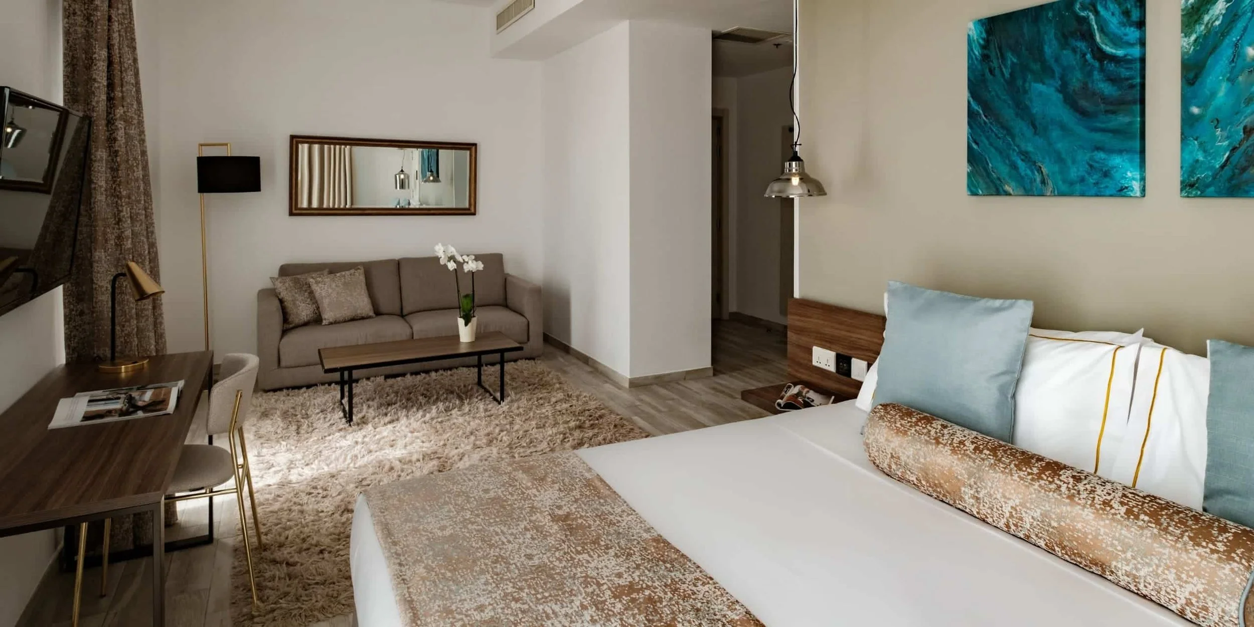 SIGNATURE SUITE - Located on the top floor, this signature suite offers expansive views, a private corner terrace with hot tub, and a refined residential atmosphere.