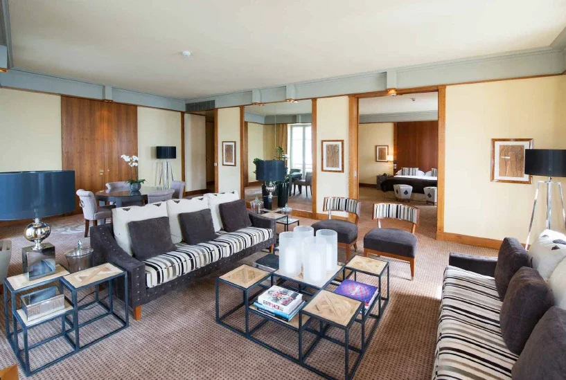 ESPLANADE SUITE - A luminous lakeside suite with sweeping views of Lake Neuchâtel and the Alps, featuring a spacious private terrace and refined living areas.