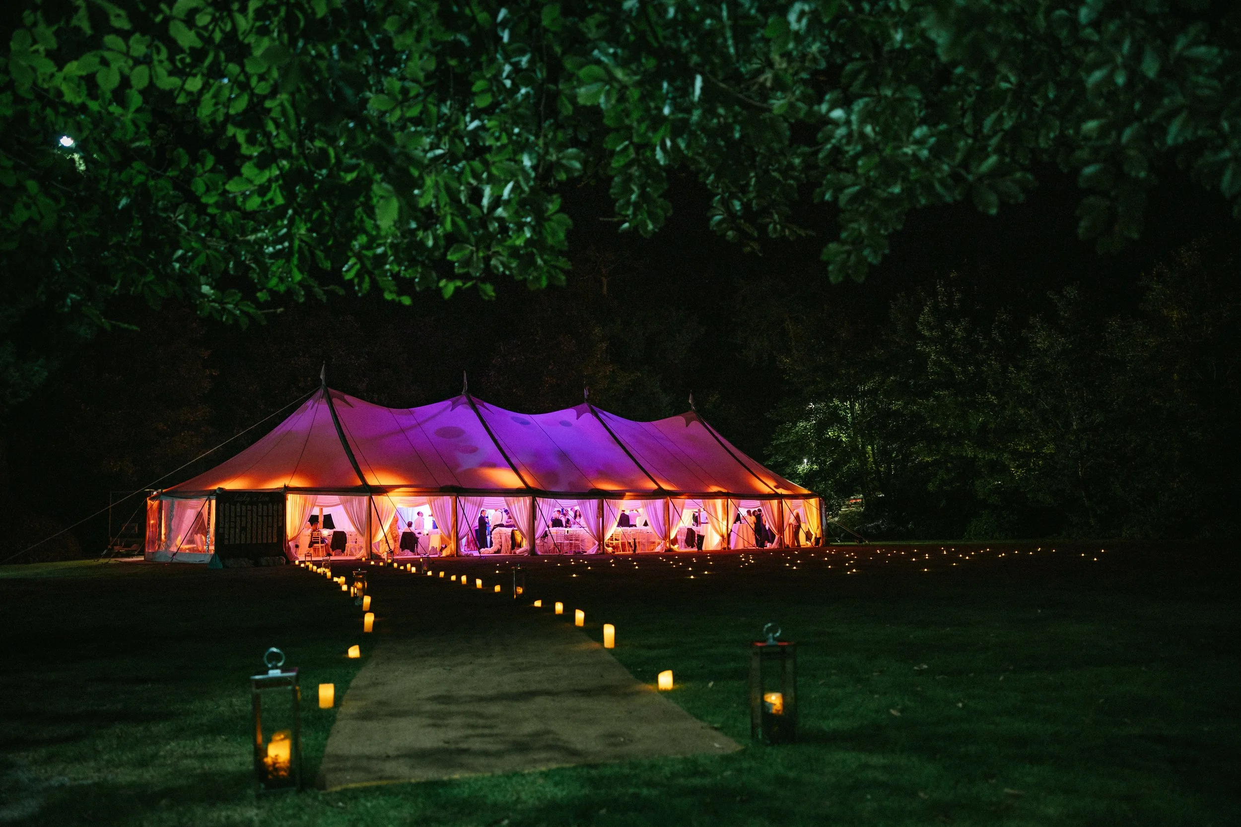 marquee wedding lit in the dark