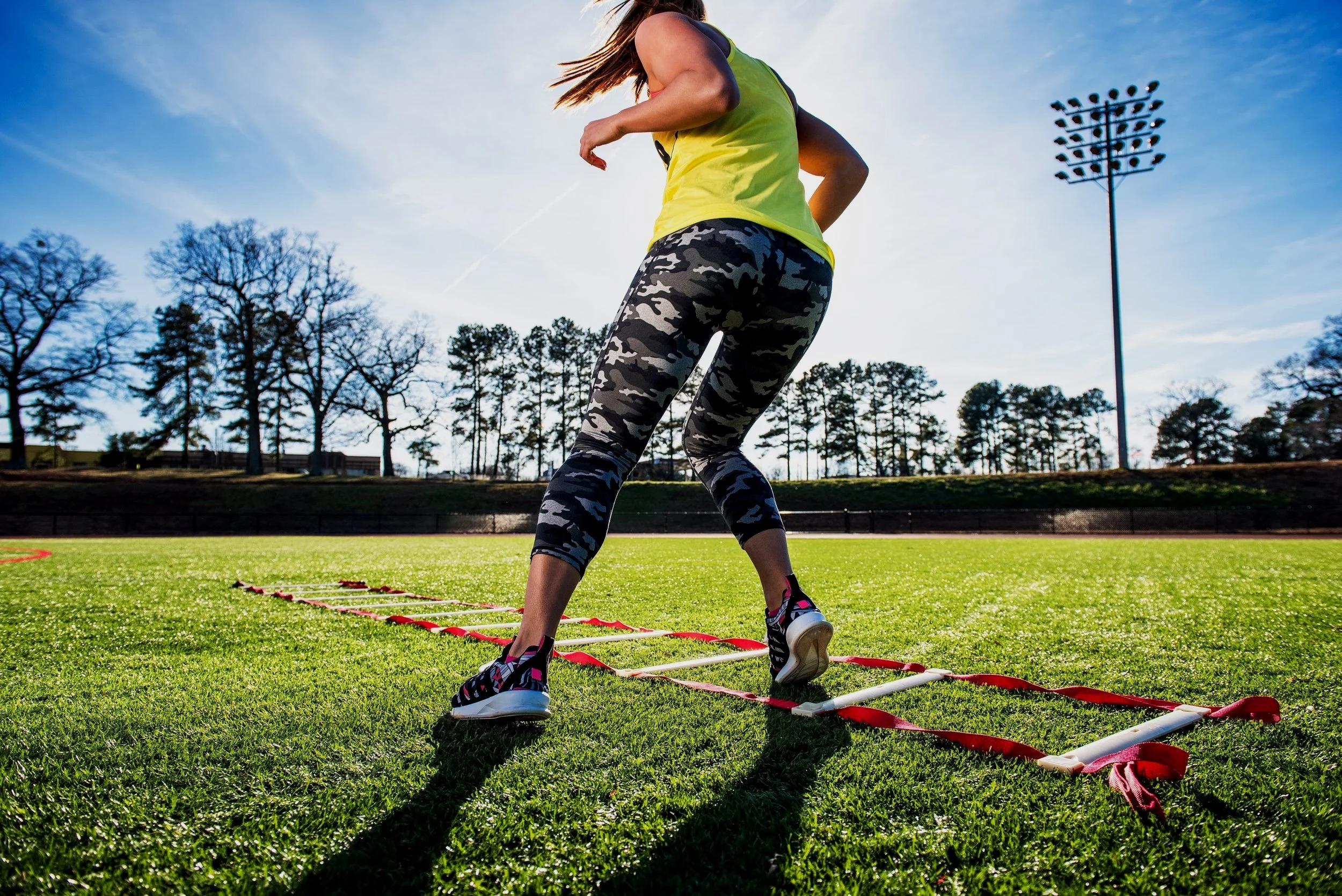 female-athlete-training-with-agility-ladder-on-spo-2024-10-18-09-47-59-utc.jpg