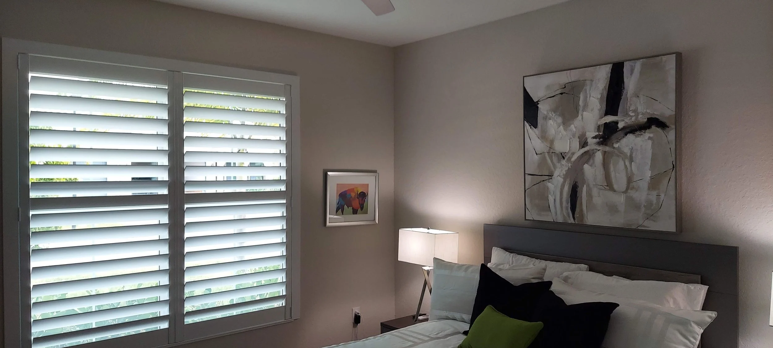 Guest bedroom walls painted in a light grey, in this Venice, FL home.