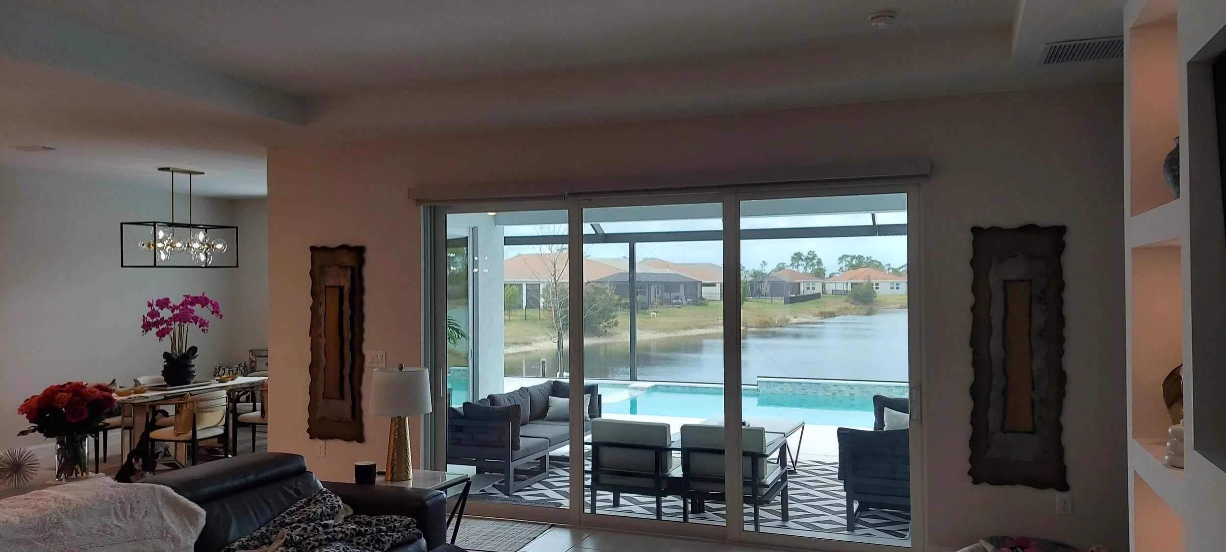 The interior walls of the home were painted in a pale grey with a dark accent color on a few walls, in this Woodlands of Venice, FL home.
