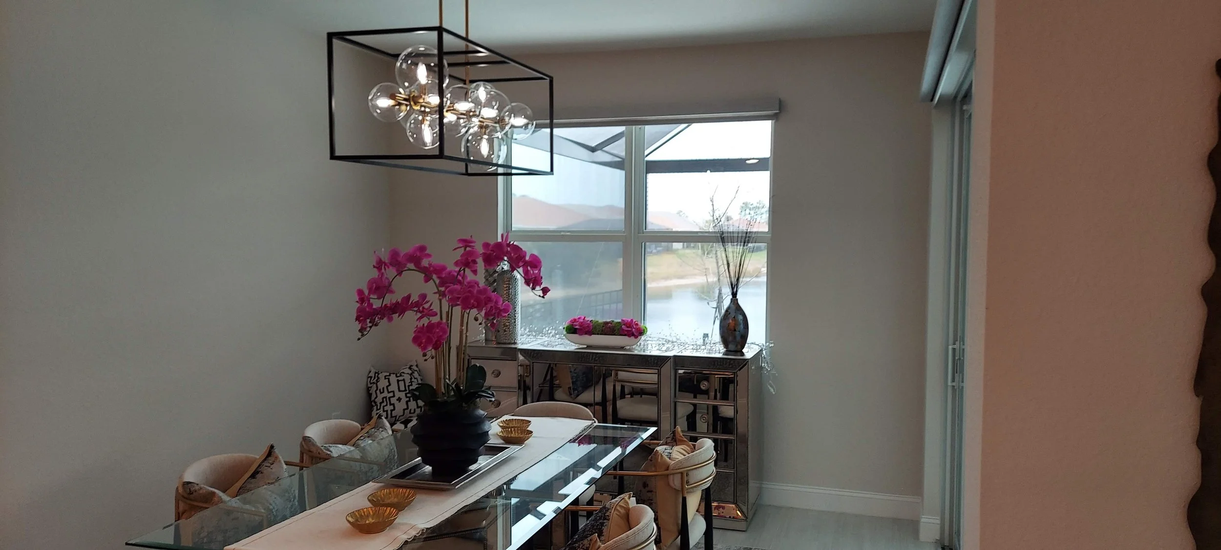 Dining room walls painted in the same light grey color as the rest of the home in Venice FL.