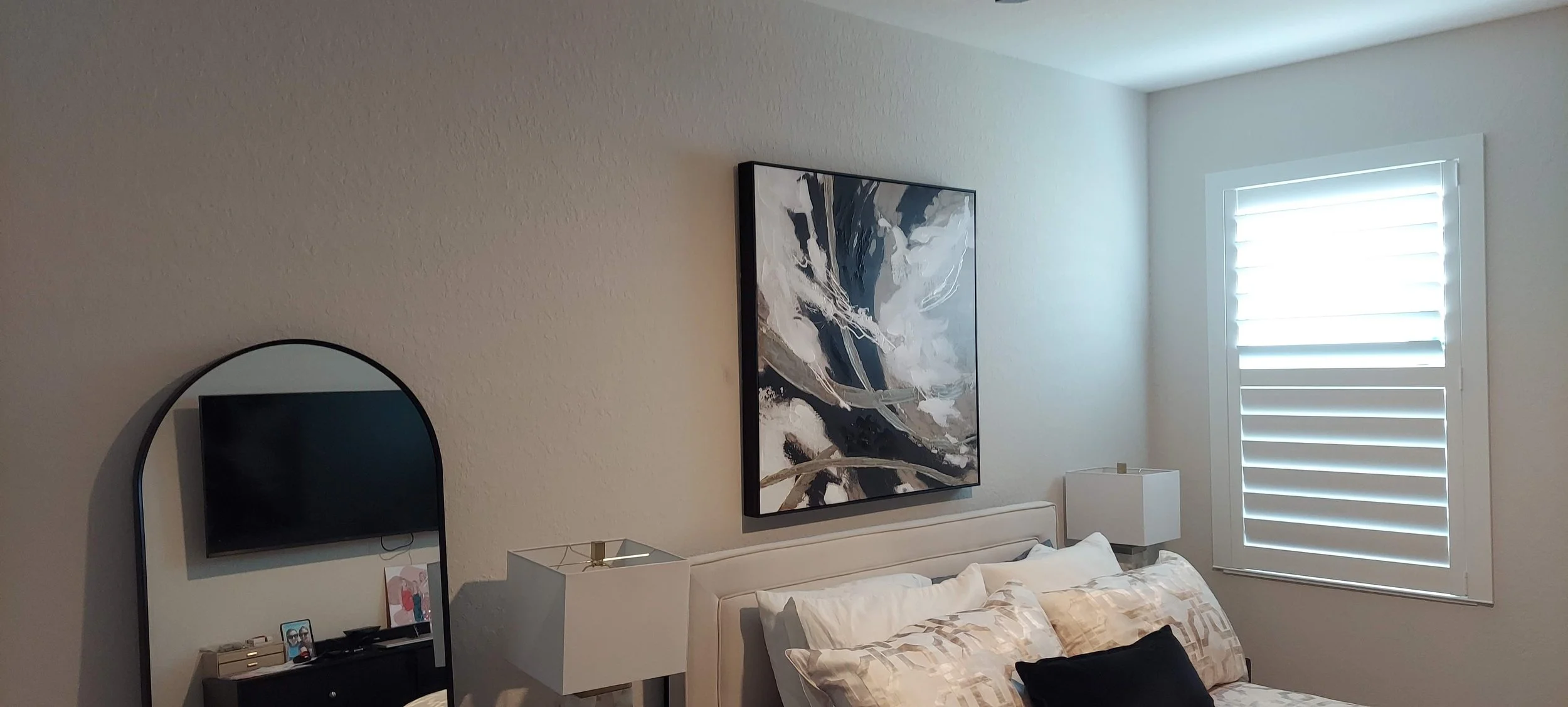 Another bedroom painted in the light grey walls color of this Venice, FL home.