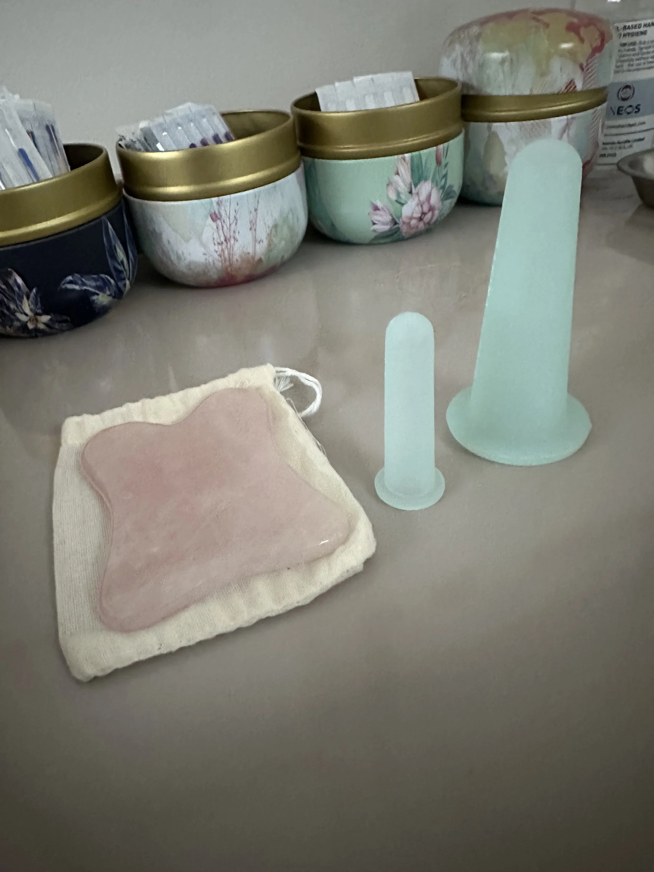 a gua sha tool and facial cupping for a soothing finish to a facial acupuncture treatment in a local treatment space in Highgate