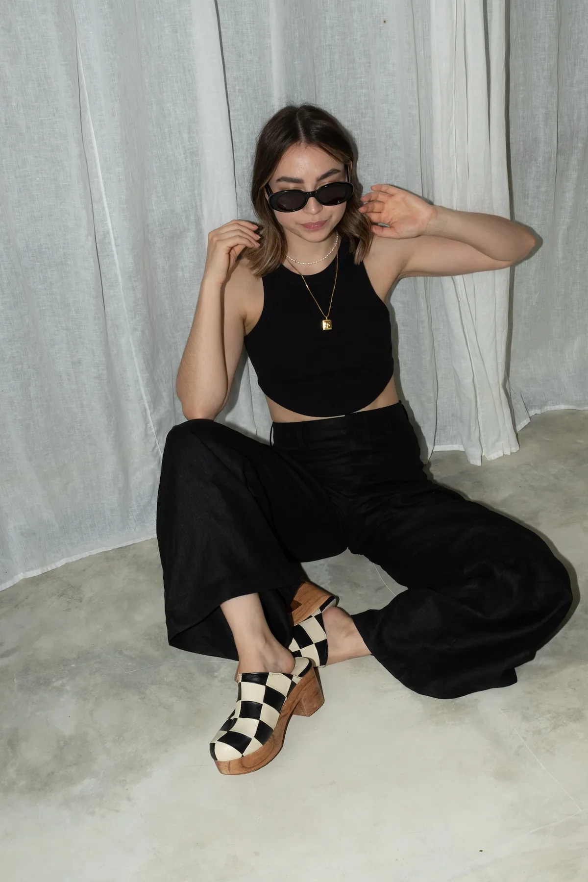 linen-noir-black-singlet-checkered-clogs-1.webp