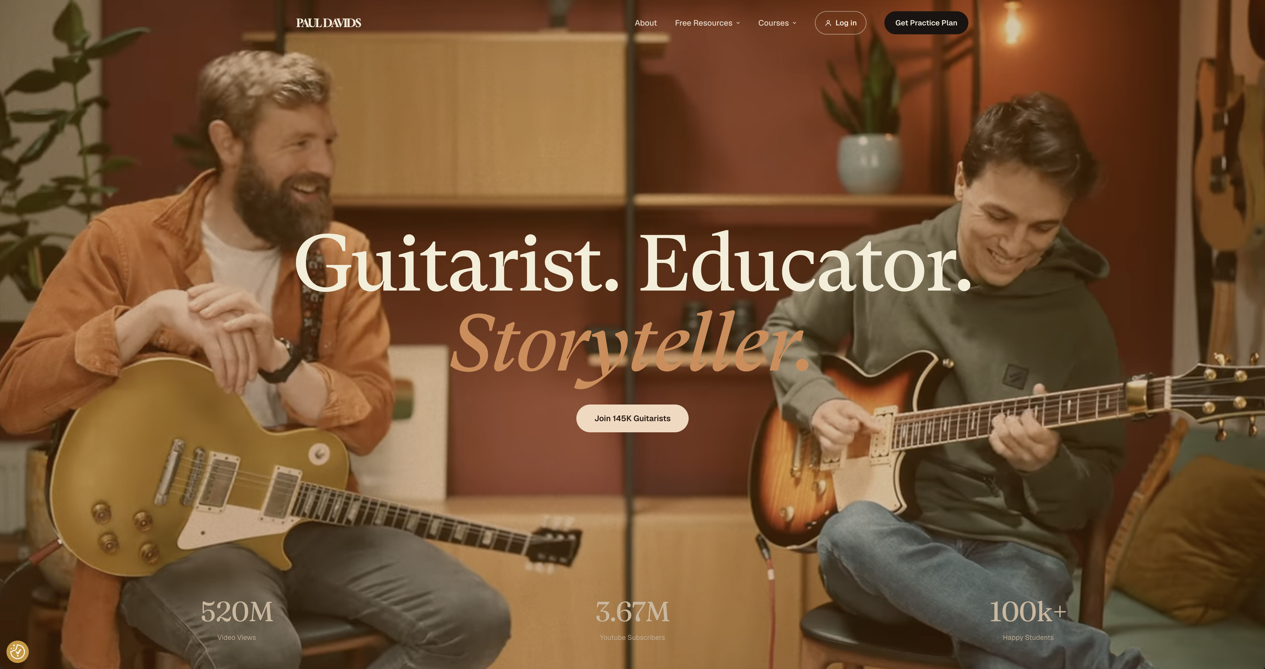 Paul Davids website banner with two guitarists playing electric guitars together in a cosy studio