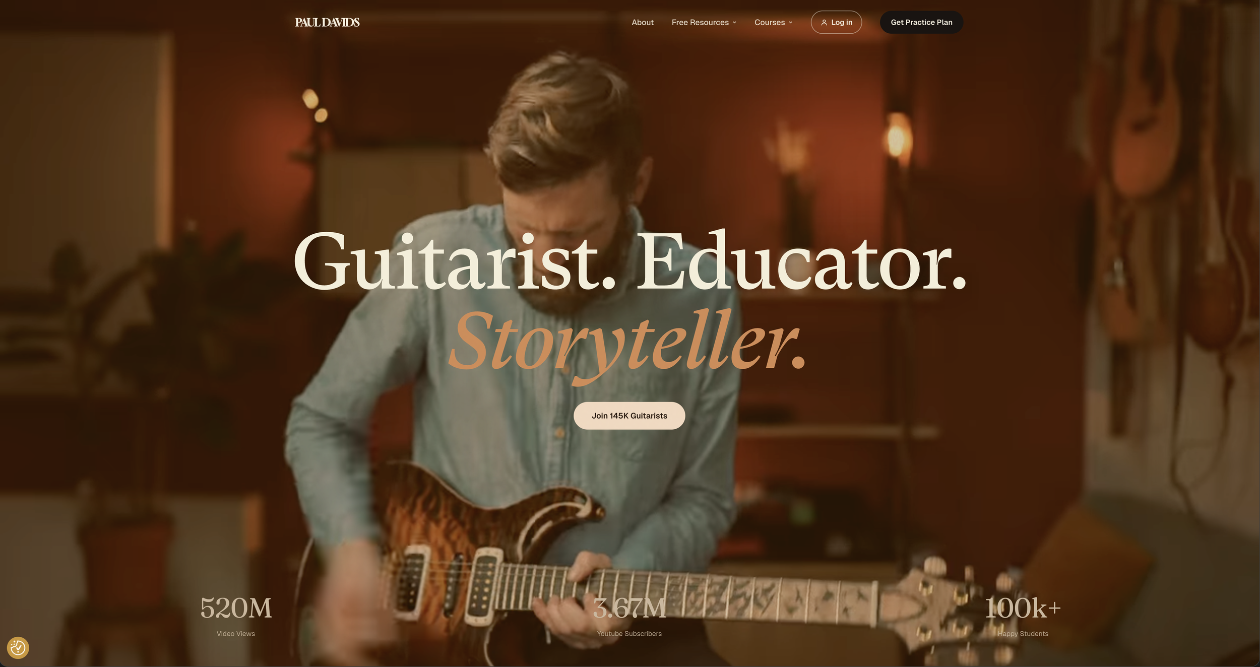 Paul Davids website homepage with him playing an electric guitar in a studio.